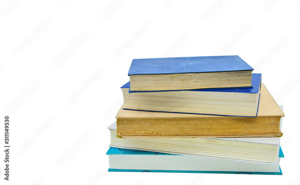 Books, stacked over one another in front of a white background Books, stacked over one another in front of a white background