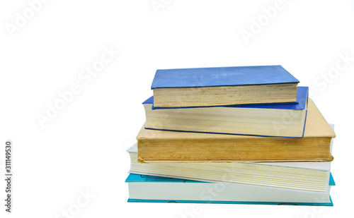 Books, stacked over one another in front of a white background