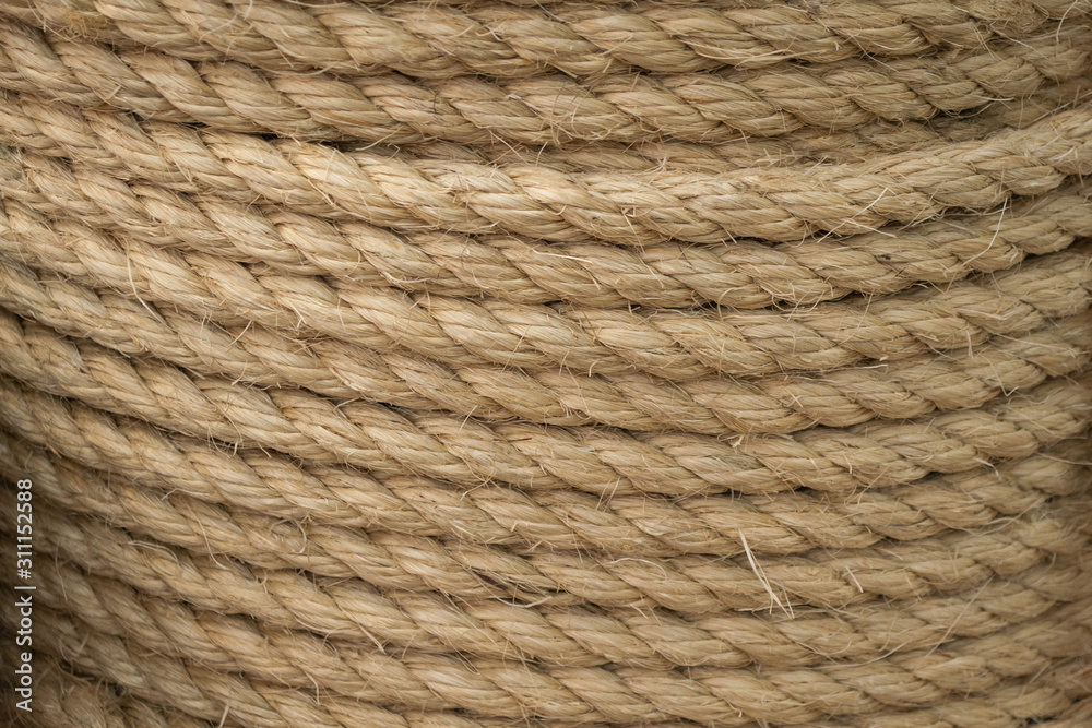 Texture of coiled sisal rope. Several layers of thick rope as