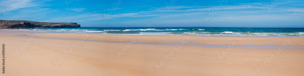 Fototapeta wide sandy beach Bordeira, west algarve portugal. without people