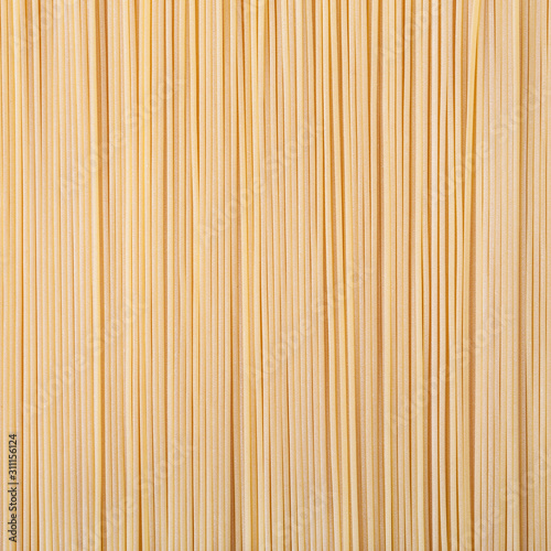 Uncooked dried spaghetti pasta background