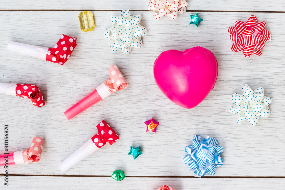 Celebration above various party confetti with pink heart accessories.Christmas concept,with decoration for New Year concept copy space,Top view,flat lay Celebration above various party confetti with pink heart accessories.Christmas concept,with decoration for New Year concept copy space,Top view,flat lay