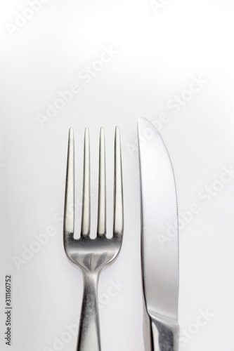 glittering reflection on a fork and knife