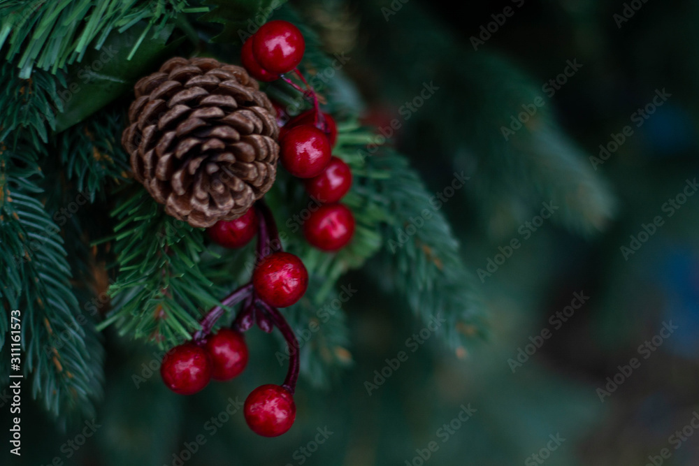 New year holiday evergreen tree, Christmas tree branches decorated with viburnum berries and cones. New year holiday evergreen tree, Christmas tree branches decorated with viburnum berries and cones.