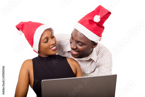 close-up of a young couple with laptop, happy.