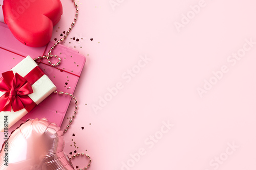 Valentines day composition, background with   heart, tablet, gift box with red ribbon, on pink background. February 14 greeting card © sonia