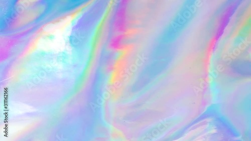 Holographic foil motion looping of purple liquid movement. Aesthetic concept.