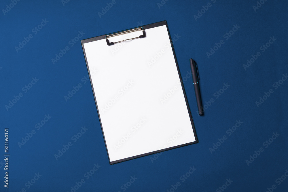 blank office objects organized for company presentation on blue paper background blank office objects organized for company presentation on blue paper background