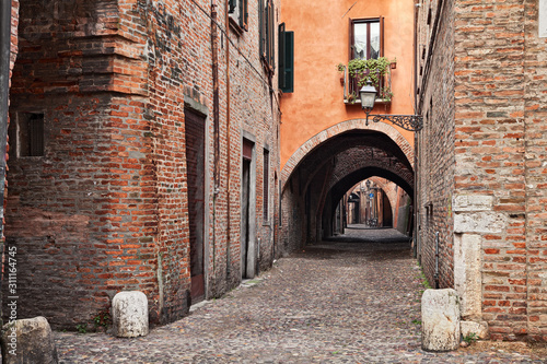 Fototapeta Naklejka Na Ścianę i Meble -  Ferrara, Emilia Romagna, Italy: the medieval  arched alley Via delle Volte