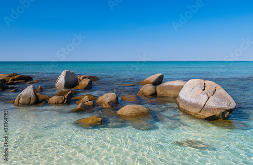 Lanscape view of white stones in blue sea. © NPD stock