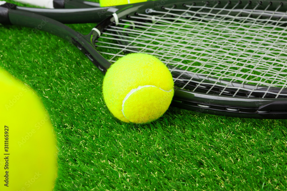 Tennis balls on  grass close up. Tennis equipment