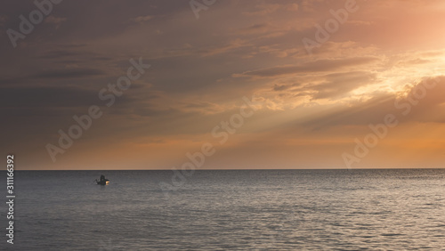 Small fisherman boat in the sea. © NPD stock