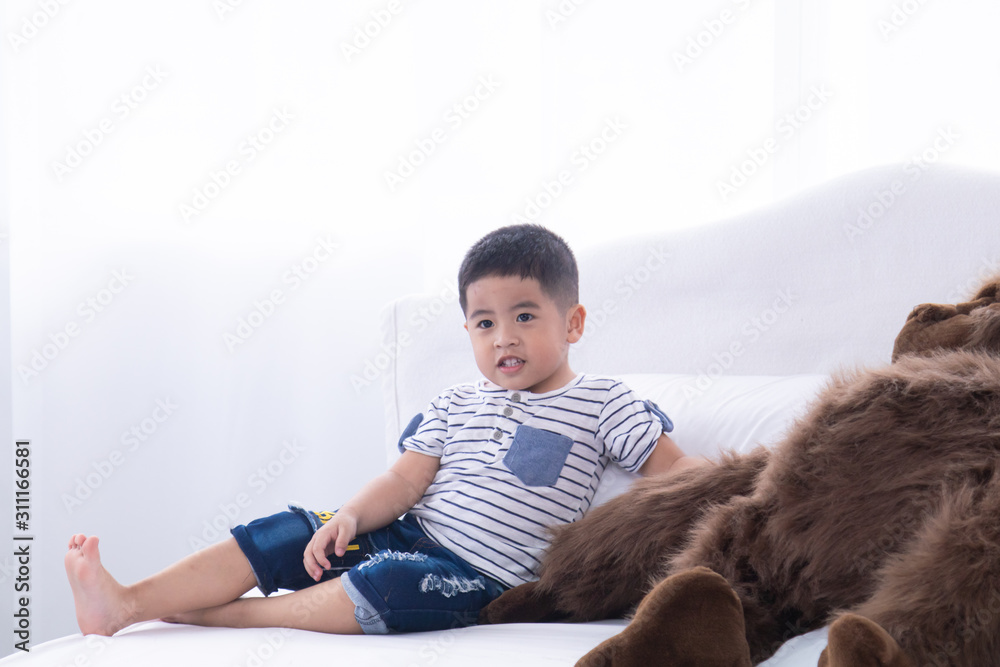 Selective focus Asian adorable boy kid happy playing on bed at home, Asian preschool cute boy kid playing on bed with hiding in white pillows, happy lifestyle boy kid on bed with copy space Selective focus Asian adorable boy kid happy playing on bed at home, Asian preschool cute boy kid playing on bed with hiding in white pillows, happy lifestyle boy kid on bed with copy space