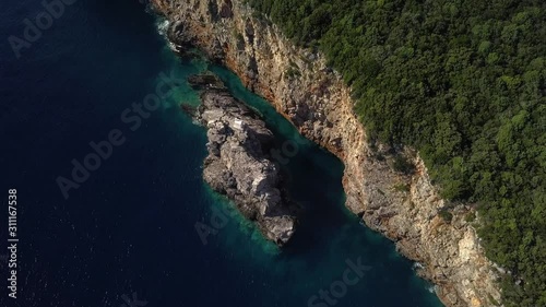 Aerial view of incredible church on top of cliff in Adriatic sea outside Montenegro Budva photo