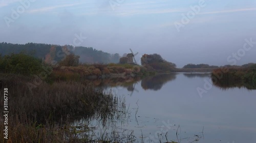 Misty quiet October morning on the banks of the river Sorot. Mikhailovskoe, Pushkin Mountains  photo