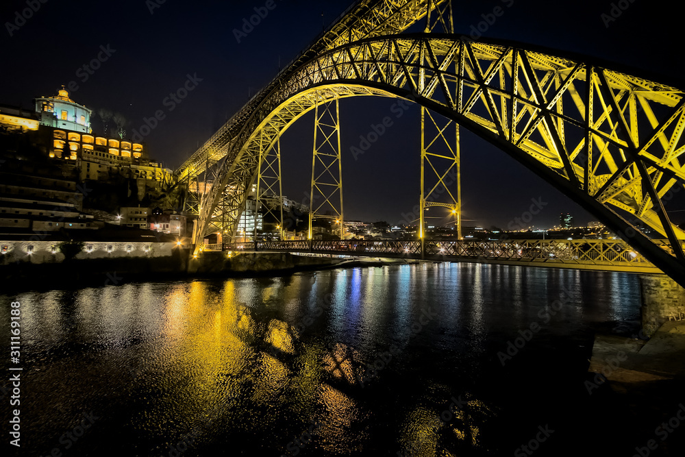 The bridge of the old city of Porto. The streets of Porto at night. Portugal.