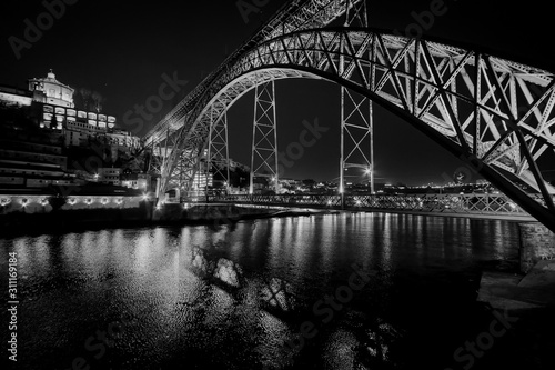 The bridge of the old city of Porto. The streets of Porto at night. Portugal. Black and white. © Svetlana