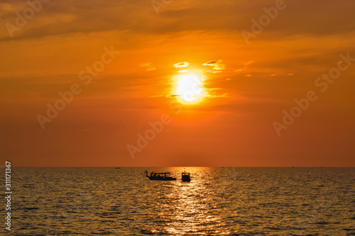 Two lonely ships on a wide ocean during beautiful orange sunset in Asia © MartinZizlavsky