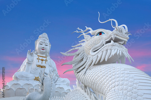 Exterior of Wat Huay Pla Kang, Big Buddha temple at sunset in Chiang Rai, Northern Thailand photo