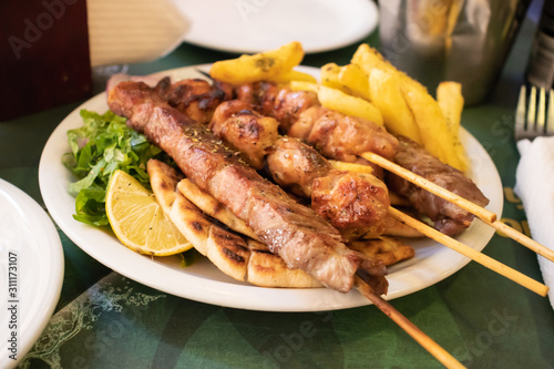 Traditional souvlaki greek dish with chicken and meat in athens photo