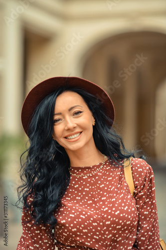 Young woman walking happily on the streets of Bucharest