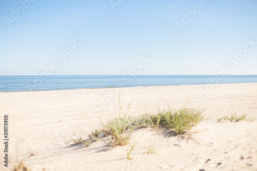 Beach on sunny summer day. Sand and water afternoon