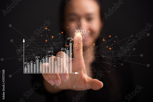 woman touching on screen.plans to increase business growth and an increase in the indicators of positive growth in 2020.