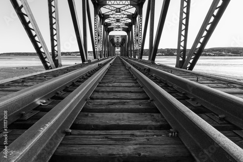 Black and white photo of railway bridge.