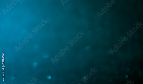 blue Abstract glitter bokeh on black background