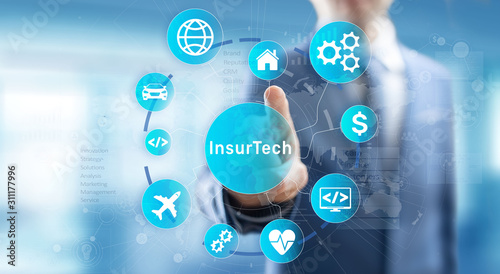 Insurtech button on virtual screen. Insurance technology internet digital iot insured family car property health. photo