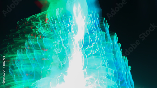 Blur the bokeh from the tree. LED lights use line drawing methods to create color, shape.