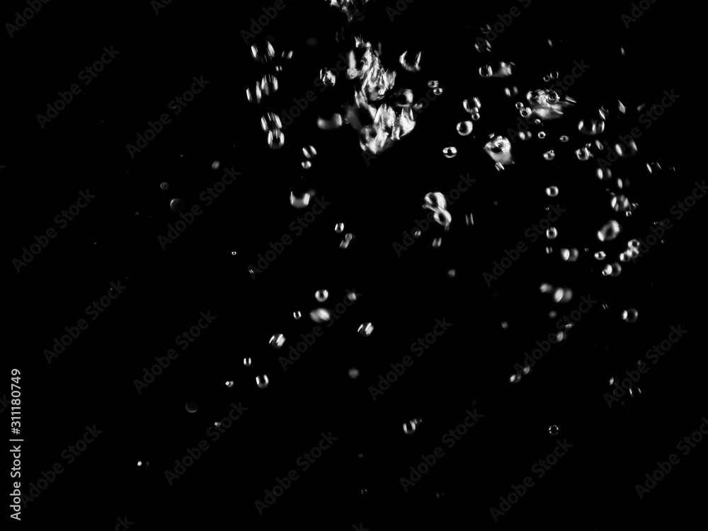 White bubbles on a black background. White bokeh. Black and white images. White bubbles on a black background. White bokeh. Black and white images.