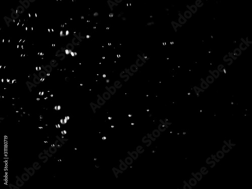 White bubbles on a black background. White bokeh. Black and white images. © pipat