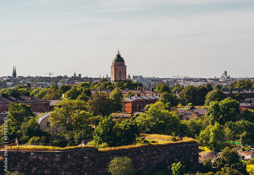 View of Suomenlinna with the city skyline in the background at summer, Helsinki Finland