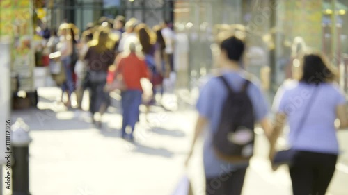Wallpaper Mural Dynamic urban scene with blurry people walking, NYC shopping area, bright sunny summer day, slow motion Torontodigital.ca