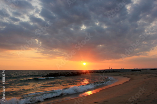 Sunrise over the sea and beautiful cloudscape , Sea on the sunset PMY Beach Rayong Landmark Thailand.