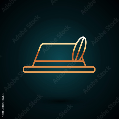 Gold line Oktoberfest hat icon isolated on dark blue background. Hunter hat with feather. German hat.  Vector Illustration