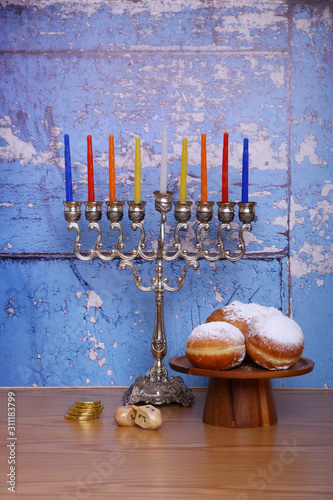 hanukkah menorah candles  blue wood background