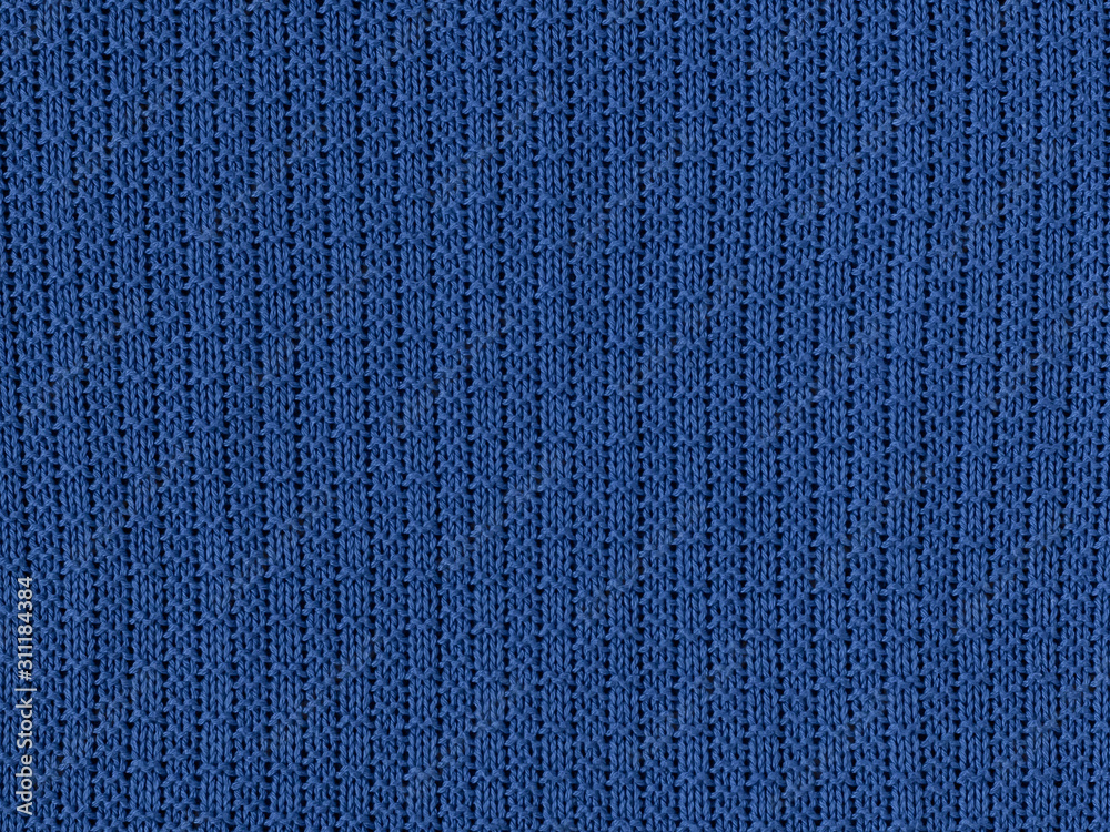 Fototapeta premium Handmade knitting texture in classic blue color background. color of the year 2020 pantone