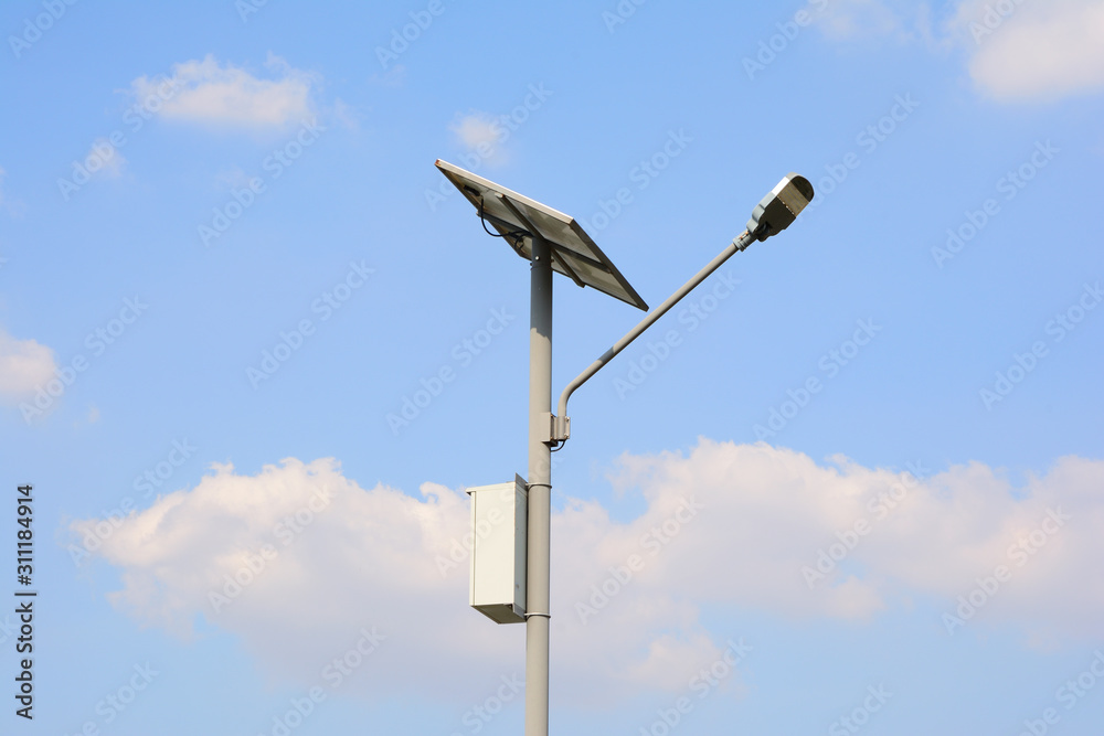 Close up of steel pole with lamps and solar cells With a background sky