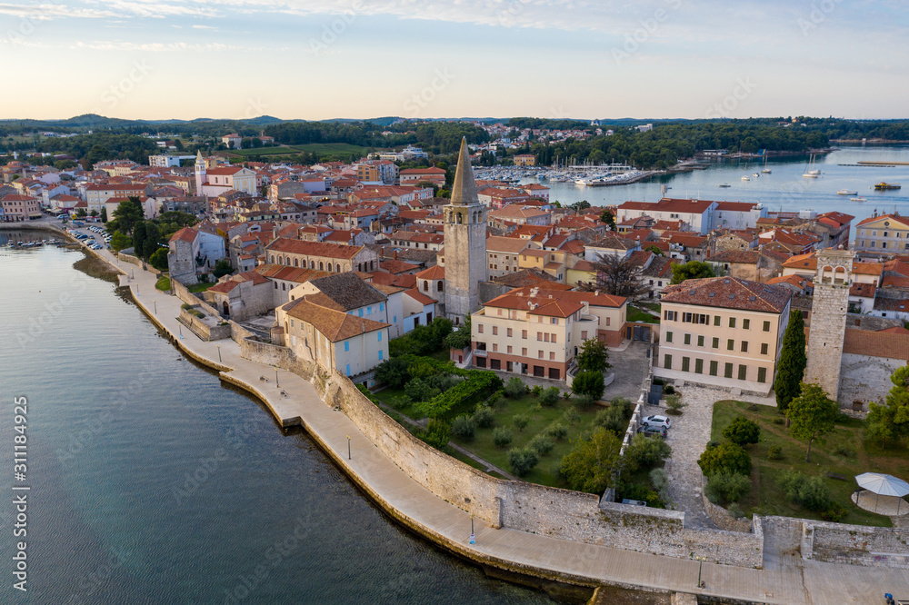 Fragment of the waterfront of the old city close-up. Porec, Croatia. Shooting from a drone.