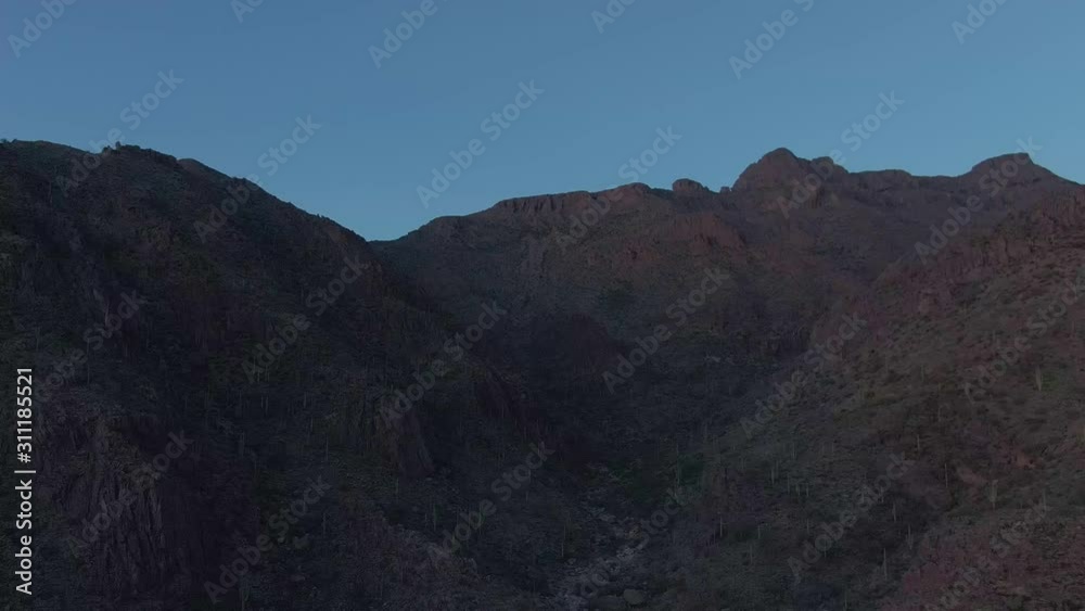 Slow motion flying towards an Arizona mountain at dusk. Slow motion flying towards an Arizona mountain at dusk.