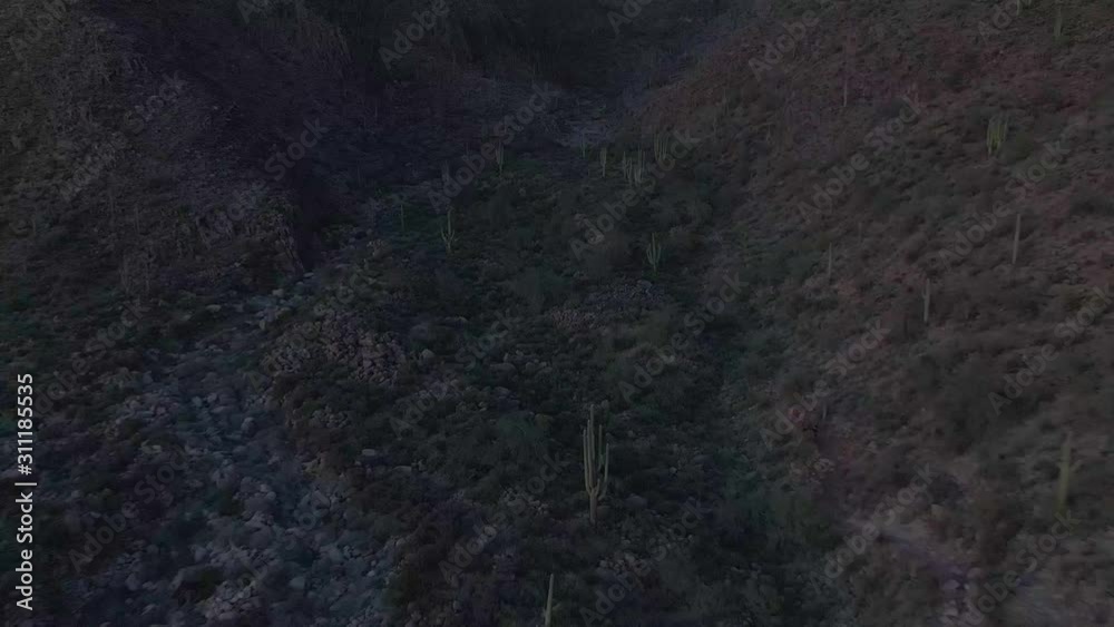 Flying through a desert canyon in Arizona at dusk. Flying through a desert canyon in Arizona at dusk.