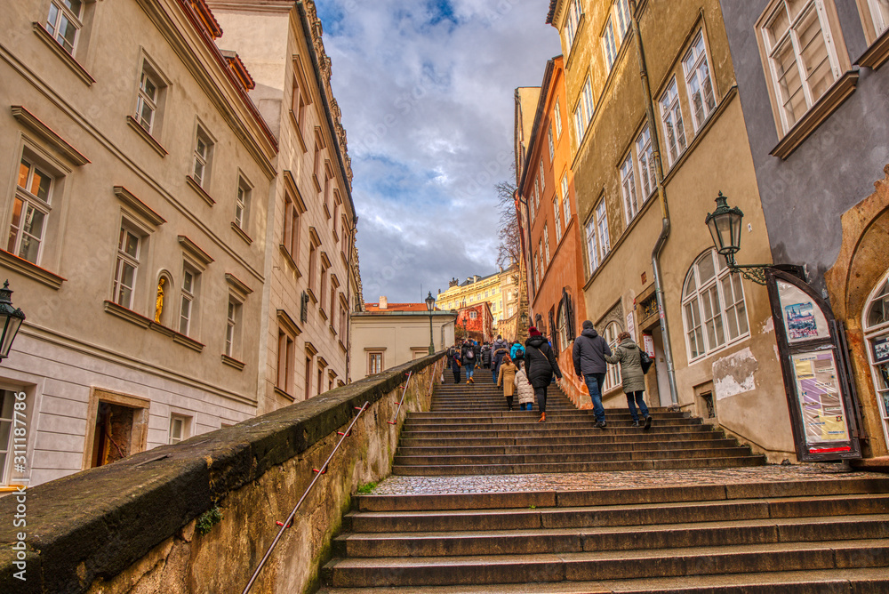 historic staircase to the castle in the center of Prague with tourists