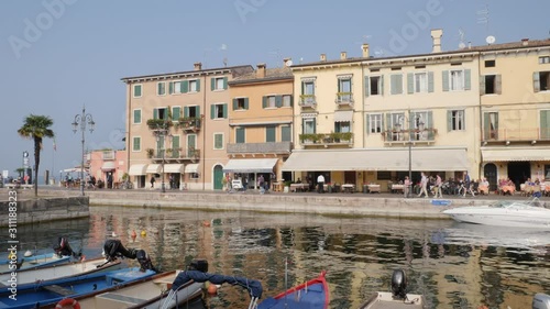 People and Tourists on Lake Walk in Lasize, Garda Lake, Italy. photo