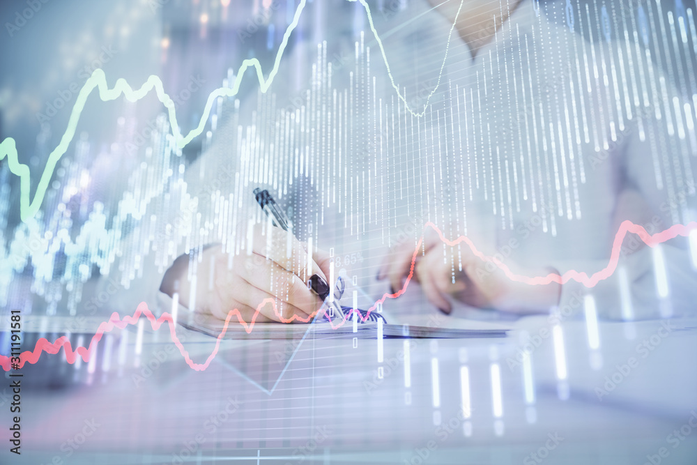Financial chart drawn over hands taking notes background. Concept of research. Multi exposure Financial chart drawn over hands taking notes background. Concept of research. Multi exposure