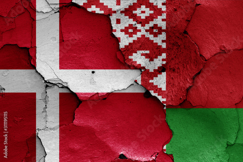 flags of Denmark and Belarus painted on cracked wall