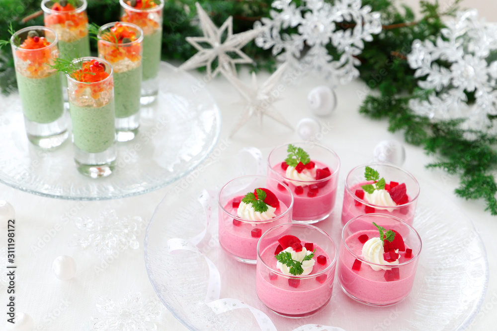 Christmas appetizers, mousse with beetroot , avocado and spinach in glasses. Christmas appetizers, mousse with beetroot , avocado and spinach in glasses.