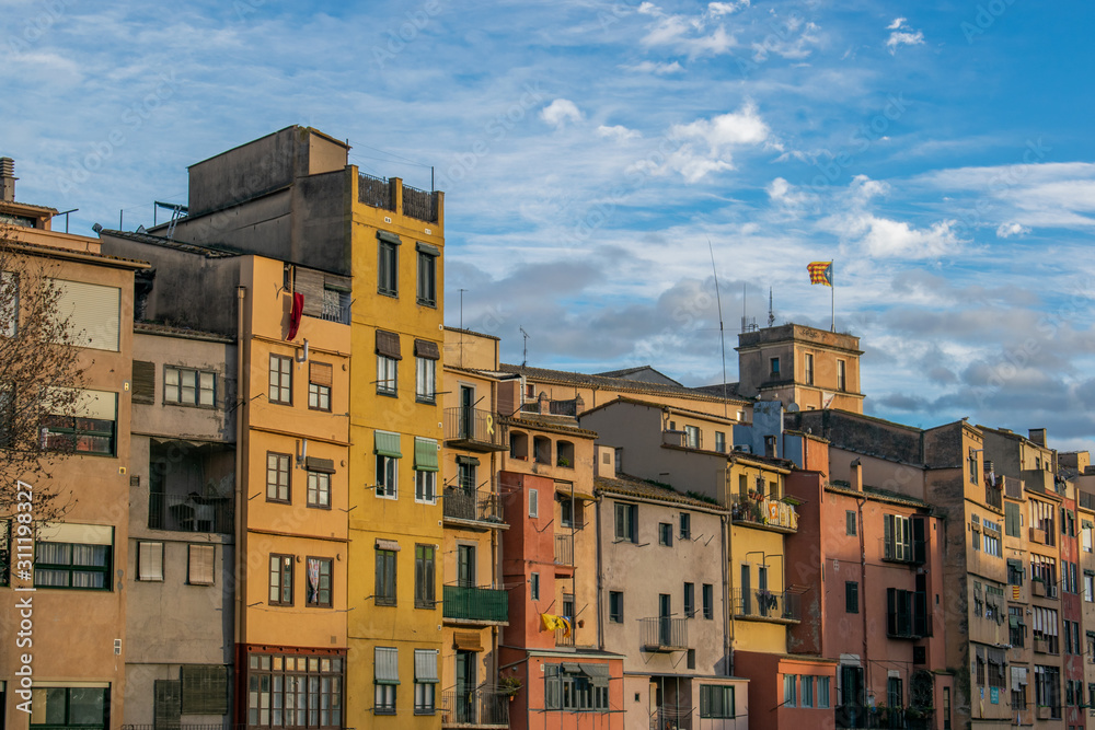 Colorful houses besides the banks of Riu Onyar, between the old town and the center of Girona (Spain).