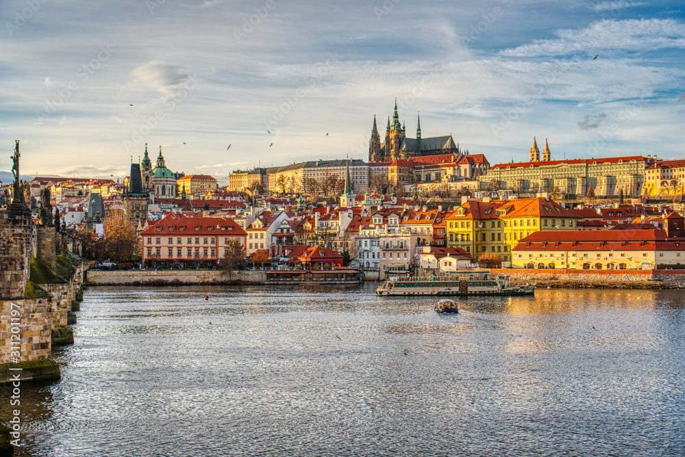 Fototapeta premium Beautifully lit Mala Strana with Charles Bridge at sunset, Prague